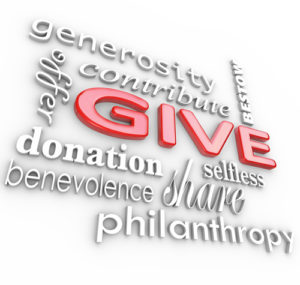 Many 3D words on a white background with a big word Give in red letters surrounded by related terms such as donation, benevolence, offer, share, generosity, con